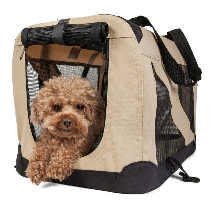 Toy poodle resting inside a beige soft-sided crate with mesh panels
